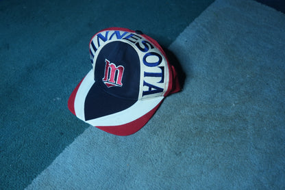 Side view of a vintage 90s Minnesota Twins MLB baseball snapback hat with embroidered graphic brim
