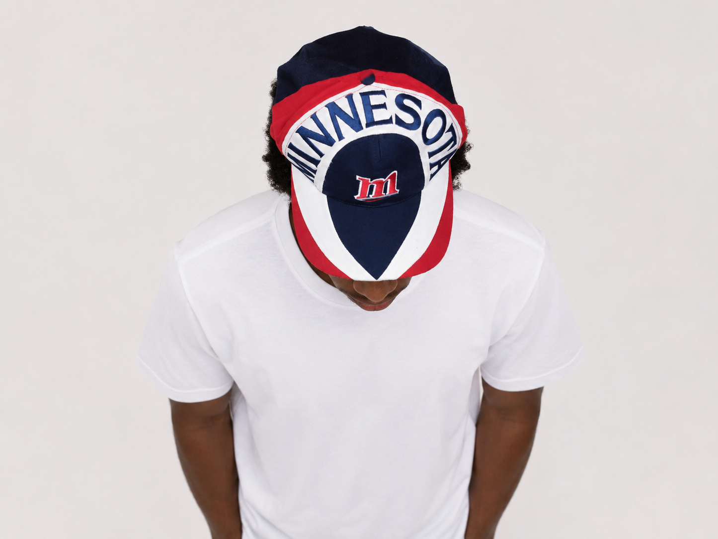 Top down view of a vintage 90s Minnesota Twins MLB baseball snapback hat with embroidered graphic brim
