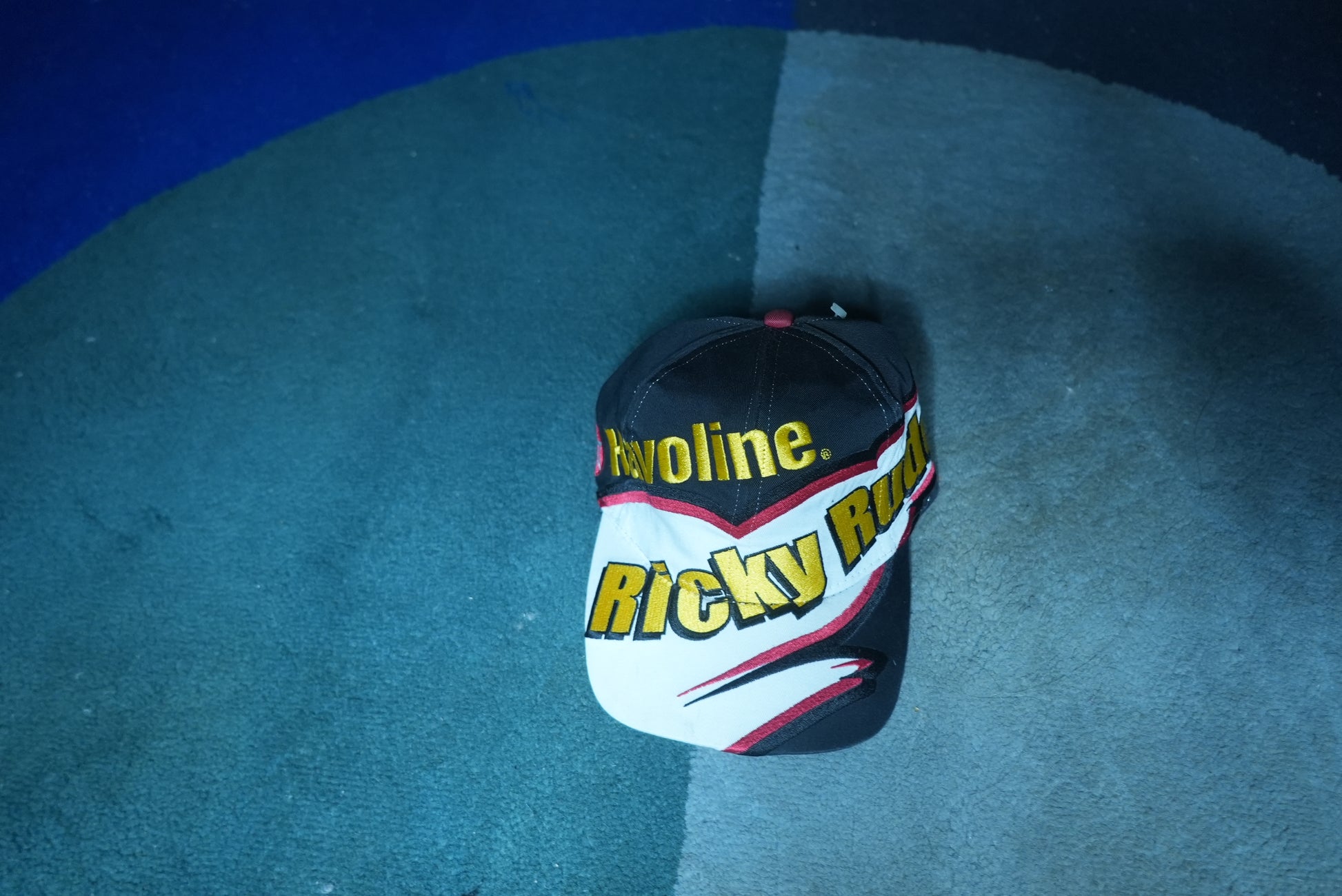 front  view of a vintage Ricky Rudd Valvoline NASCAR racing snapback hat with graphic brim design
