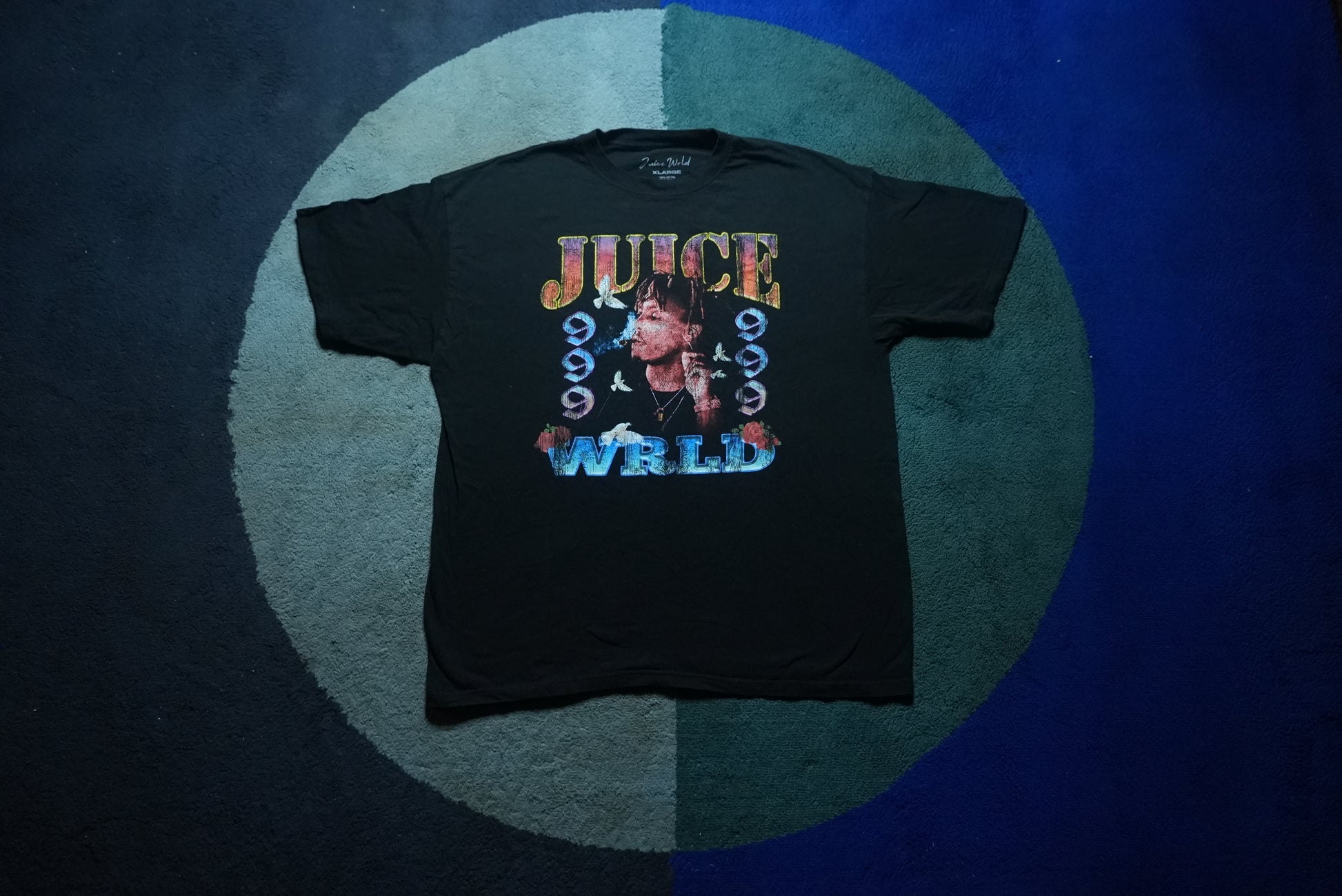 Front view of a black Juice WRLD graphic tee shirt with 999 portrait design in size Extra Large
Front view of a black Juice WRLD graphic tee shirt with 999 portrait design in size Extra Large
