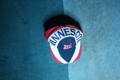 top down front view of a vintage 90s Minnesota Twins MLB baseball snapback hat with embroidered graphic brim
