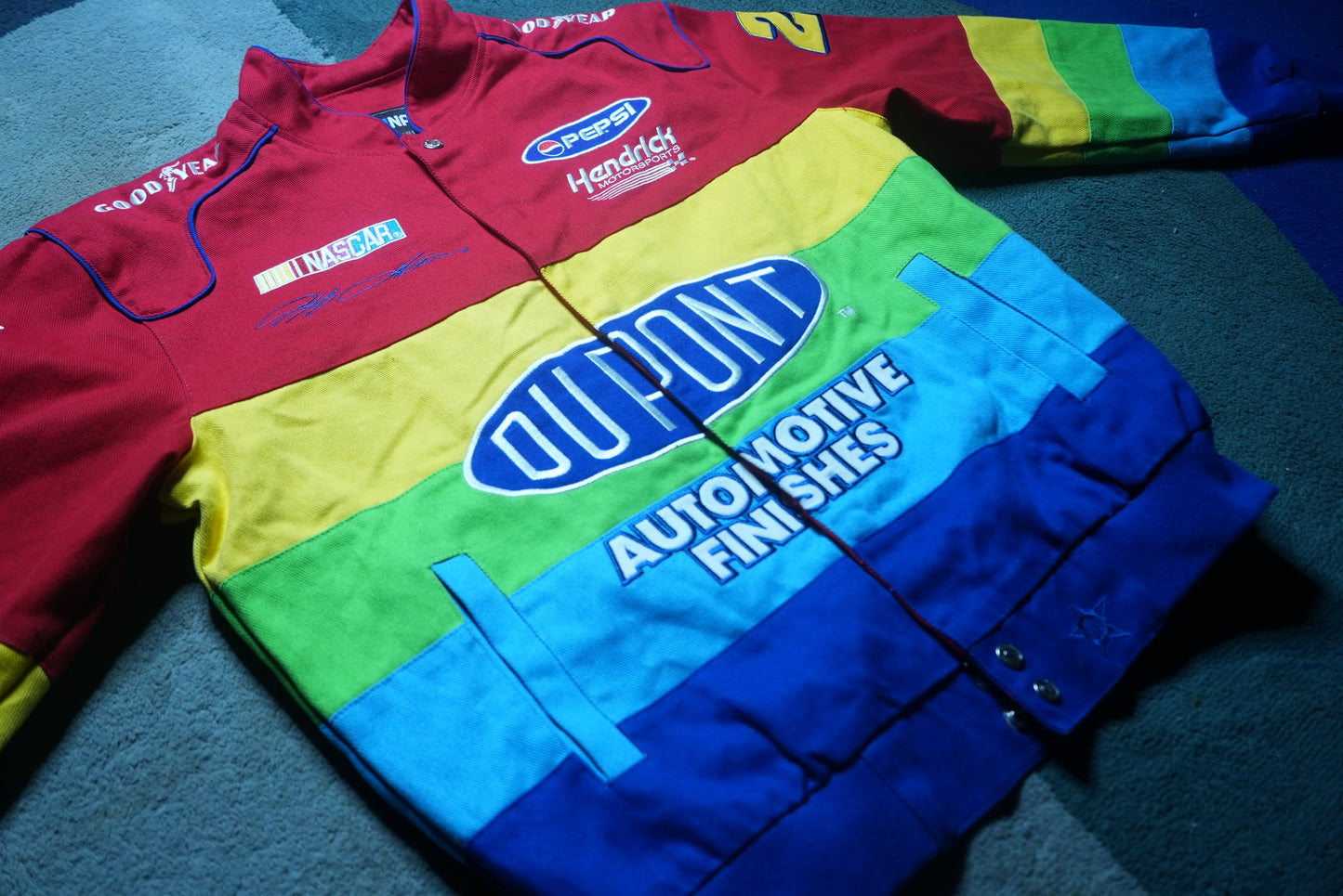 side view of vintage Jeff Gordon DuPont NASCAR racing jacket in size Medium
