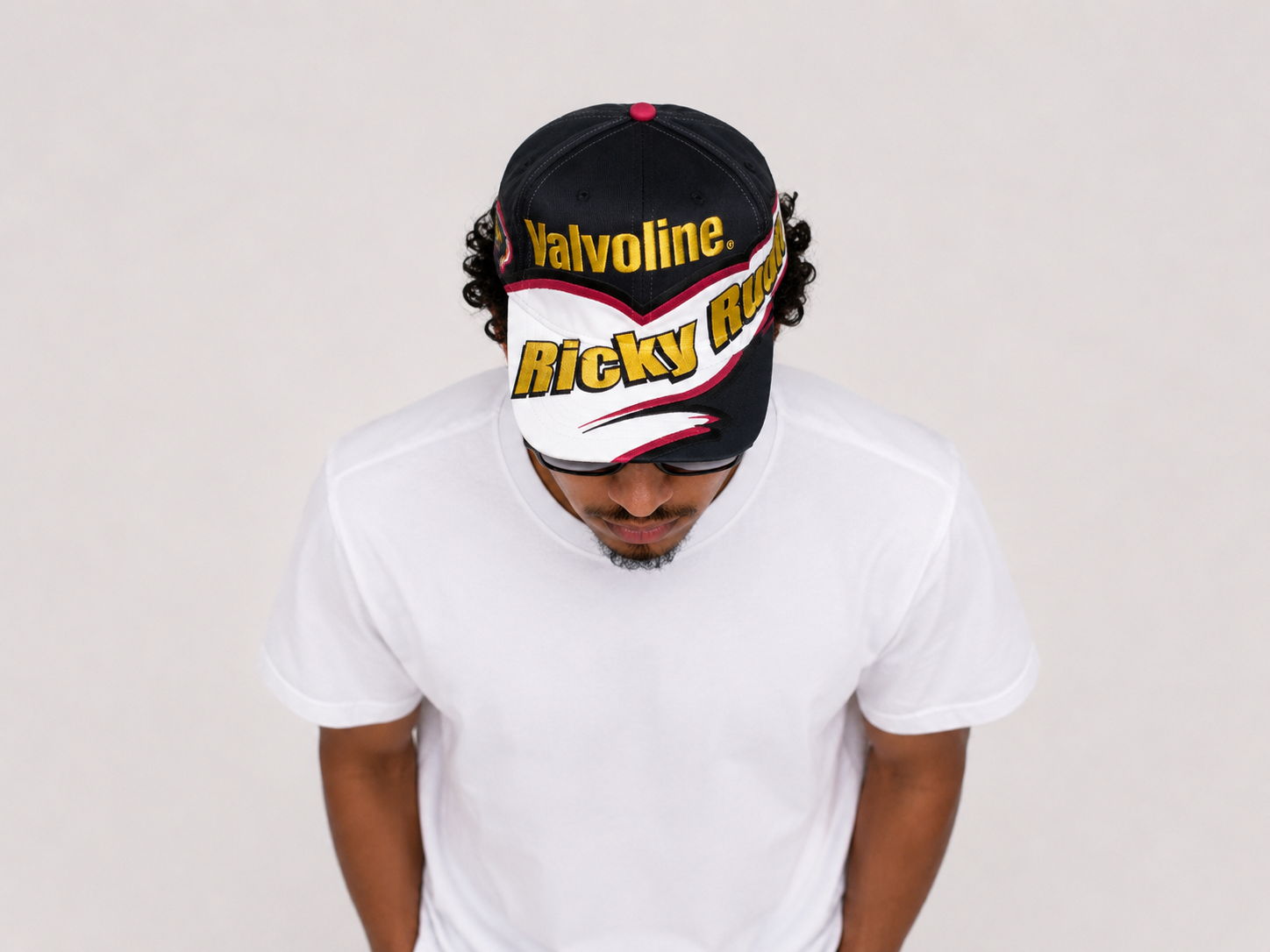 Top down view of a vintage Ricky Rudd Valvoline NASCAR racing snapback hat with graphic brim design
